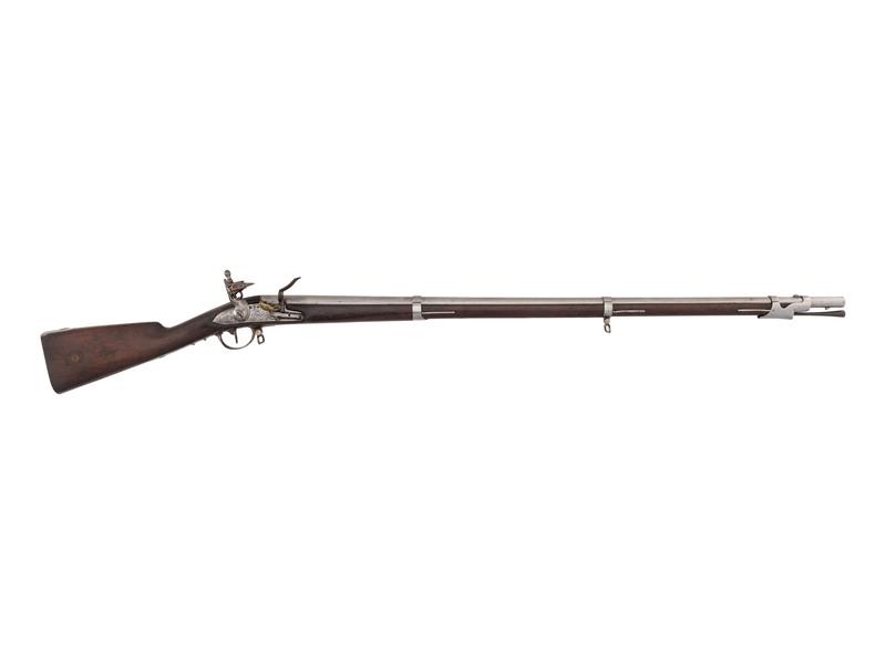 Composite French Model 1777 Flintlock Musket Reworked by Dresse Laloux of Liege: .71 caliber. 42.5" barrel secured by three flat, spring-retained bands. SN: 5659. Bright finish, iron furniture, full-length walnut stock with recessed cheek rest. Flint lock in original flint configu