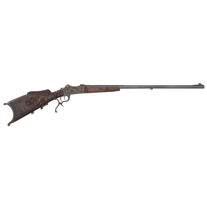 ** Finely Engraved German Schuetzen, signed "G. Meiner & Sohn": About 7.8mm. 29.75" octagonal barrel length. SN: 726. Martini-style breechloading schuetzen with falling block serpentine lever and post front sight with ear protectors. Blued metal finish to barrel w