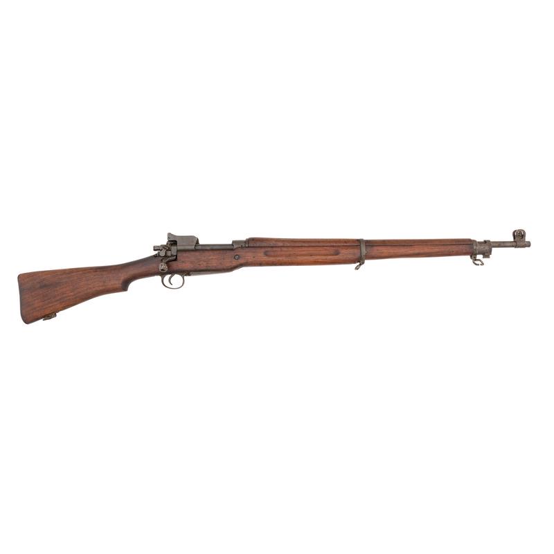 ** Winchester-Enfield U.S. Model 1917: .30-06 caliber. 26" barrel length. SN: 288908. Arsenal rebuilt bolt action rifle with adjustable folding rear aperture sight and front blade sight with ear protectors. Matte blued metal finish. Walnut