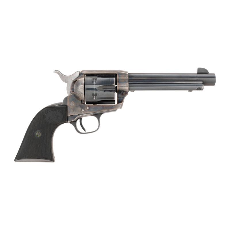 ** Early Second Generation Colt Single Action Army: .45 Long Colt. 5.5" barrel length. SN: 1104SA. Single action revolver with topstrap notch and blade sights. Blued metal finish with case hardening to frame, and checkered black plastic grips with ramp