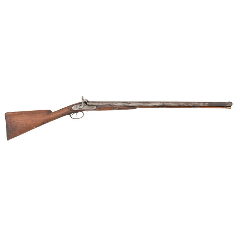 Belgian Percussion Double Barrel Shotgun: 10 gauge. 28" Damascus barrels secured by a single key. SN: NSN. No finish, steel mountings, straight grip hardwood stock with checkered wrist. No external markings, Belgian proofs under barrels. Pe