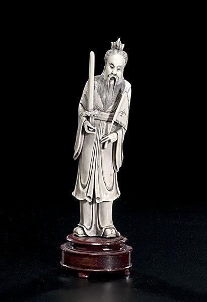 Chinese Carved Ivory God of War : Chinese Carved Ivory God of War Chinese, a carved and inked ivory God of War, on 20th century wooden stand; ht. 8.25 in.