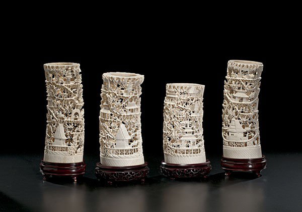 Chinese Carved Ivory Tusks : Chinese Carved Ivory Tusks Chinese, a group of four carved and pierced ivory tusks, each on 20th century wooden stands; largest ht. 10 in. Ex Property Reserve National Insurance Company, Oklahoma 