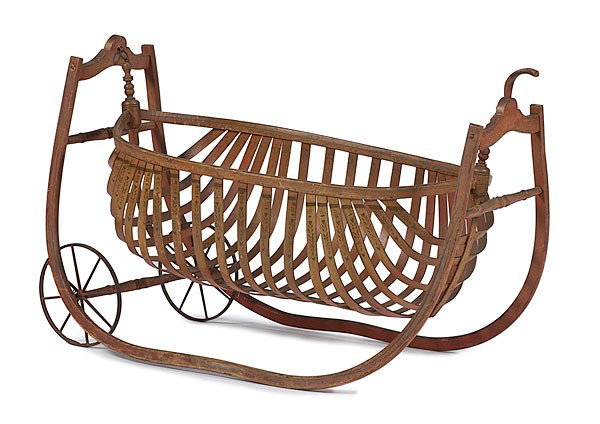 Paint Decorated Bentwood Field Cradle : Paint Decorated Bentwood Field Cradle American, 19th century. A canoe-shaped cradle of bentwood slats, decorated with geometric and floral patterns around inside rim. Likely manufactured by Ford Joh