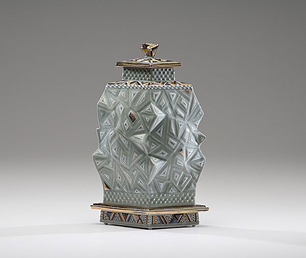 Masterworks: Ralph Bacerra Celadon Lidded Vessel wi: Ralph Bacerra (1938-2008, USA) Celadon Lidded Vessel with Carved Base ca 2000 Porcelain; ht. 14. This lidded jar shows unusual restraint for Bacerra as the main body of the piece is only lightly dec