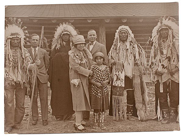 Charles J. Belden Photograph of a Group of America: Charles J. Belden Photograph of a Group of American Indians with Visitors Silver gelatin photograph, unmarked, but by Charles Belden, of a group of American Indians that appear to be Shoshone, weari