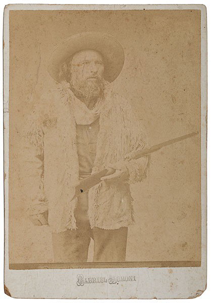 Metis Scout, Gabriel Dumont, Cabinet Card Photogra: Metis Scout, Gabriel Dumont, Cabinet Card Photograph An albumen, copy photograph of Gabriel Dumont holding a heavy caliber Ballard rolling block rifle, stamp identification on mount below image, wit
