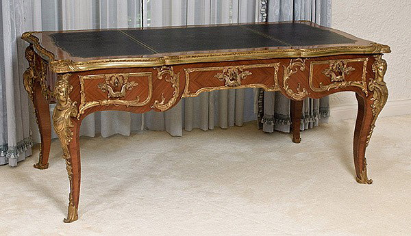 LOUIS XV-STYLE KINGWOOD BUREAU PLAT: LOUIS XV-STYLE KINGWOOD BUREAU PLAT With finely castormalu figural mounts at corners and ormolu trim, three locking drawers in front and false drawers in rear. With tooled leather top. 70" x 37" x 30"