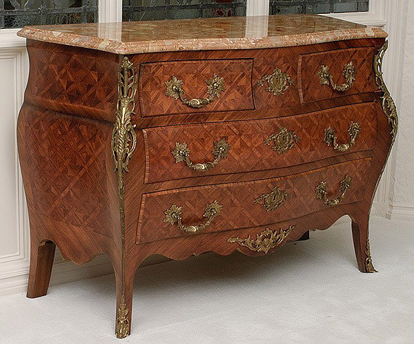 LOUIS XV-STYLE PARQUETRY COMMODES: LOUIS XV-STYLE PARQUETRY COMMODES pair of bombe form, two drawer commodes of parquerty inlay with breche marble tops and ormolu mounts. 48" x 20" x 34.5" high.