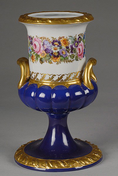 CAPO-DE-MONTE PORCELAIN URN : CAPO-DE-MONTE PORCELAIN URN Italian. With hand-painted flowers, cobalt ground and gilt highlights. Signed with crowned "N". 11.25" high. Marked Made in Italy.