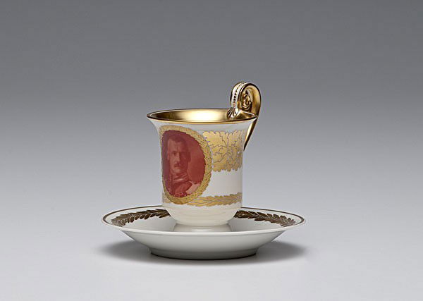 KPM Portrait Cup and Saucer : KPM Portrait Cup and Saucer German, a KPM porcelain cup and saucer, the cup with a portrait of an Imperial German officer, both marked with under glaze blue scepter, iron red KPM, and hand-painted n