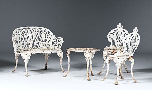 Suite of Cast Iron Garden Furniture : Suite of Cast Iron Garden Furniture 19th century, a suite of garden furniture to include a cast iron table, pair of side chairs and a bench, all in white paint; table ht. 17 in., chair ht. 32.5 in.,