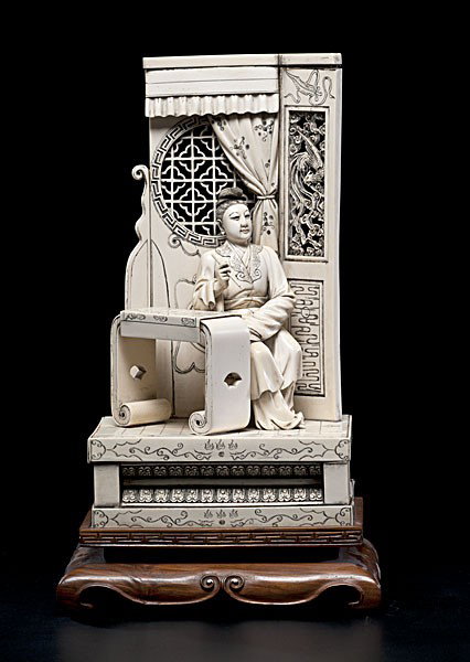 Chinese Carved Ivory Figure : Chinese Carved Ivory Figure Chinese, a carved ivory interior scene with a lady seated at table with art brush, openwork windowed screen in background, with Qianlong mark on bottom, on a wooden stand