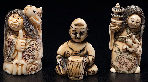 Japanese Netsukes : Japanese Netsukes Japanese, an assembled group of three kinetic ivory netsukes, two with movable two-sided faces and one with movable head, all signed; largest ht. 2 in.