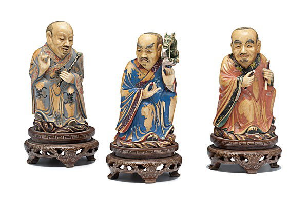 Polychrome Ivory Chinese Figures : Polychrome Ivory Chinese Figures Chinese, includes three painted ivory male figures, signed, each holding various props and each on 20th century wooden stand; ht. 5 in. (without stand)