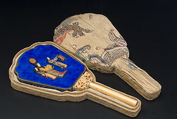 Enameled Chinese Mirror : Enameled Chinese Mirror Chinese, an enameled hand-held mirror with carved ivory handle and painted ivory figures in low relief, housed in a fabric-lined papier-mâché box with embroidered overlay; 