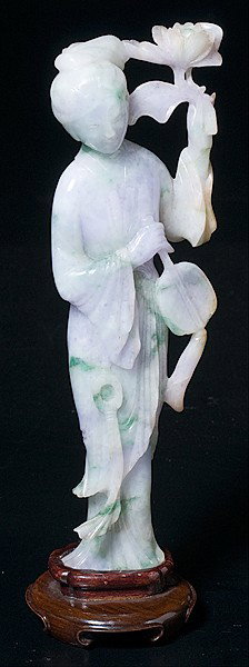 Chinese Lavender and Apple Green Jadeite Figure : Chinese Lavender and Apple Green Jadeite Figure Chinese, a lavender and apple jadeite figure of a standing maiden holding a fan in one hand and a floral branch in the other, with 20th century wooden