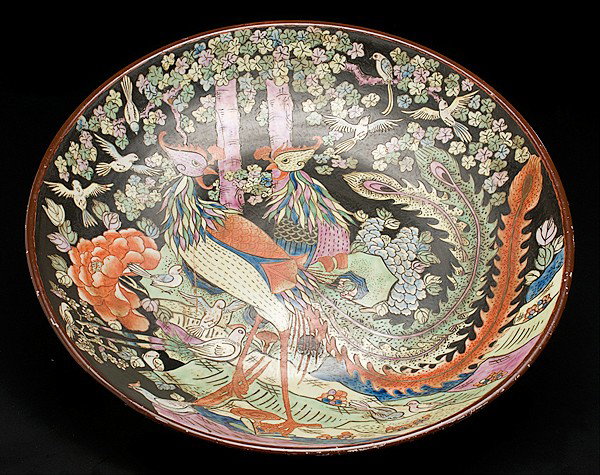 Chinese Charger : Chinese Charger Chinese, a large charger with two peacocks in a forest surrounded by birds against a black ground, with six character Kangxi mark on base; dia. 24.25 in.