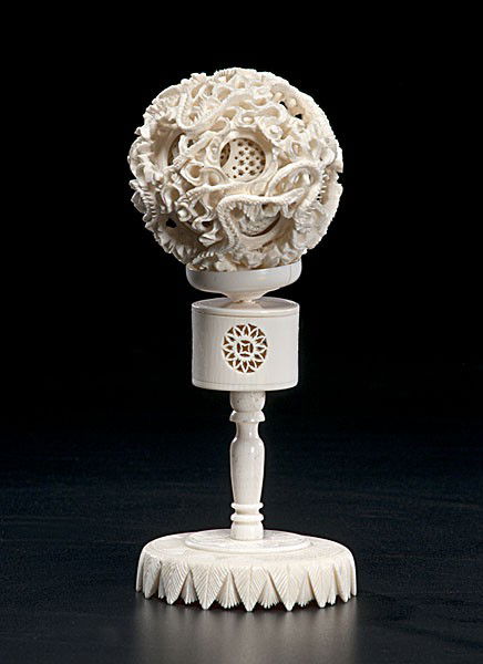 Chinese Carved Ivory Puzzle Ball : Chinese Carved Ivory Puzzle Ball Chinese, a carved ivory puzzle ball with reticulated dragons on exterior sphere and several interior spheres, set on an ivory stand; ht. 4 in., dia. 2.5 in.