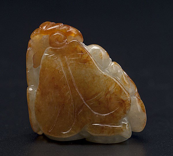 Chinese Jade Carving : Chinese Jade Carving Chinese, a carved jade monkey with a peach amidst foliage, the stone with russet shades, unmarked; ht. 1.5 in.