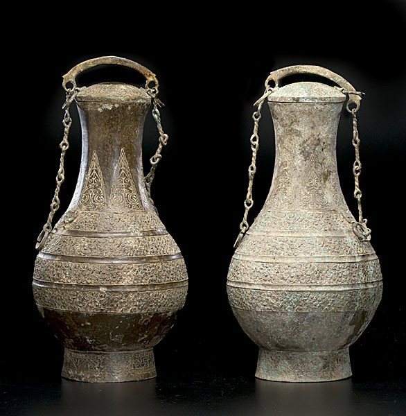 Chinese Bronze Archaic Vessels : Chinese Bronze Archaic Vessels Chinese, includes a pair of bronze lidded wine vessels in the style of Eastern Chou Han dynasty; ht. 22 in.