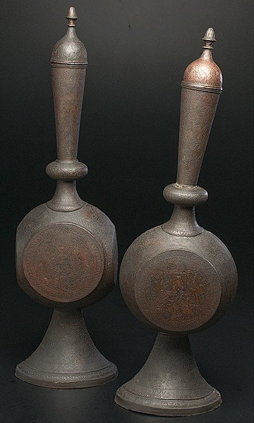 Islamic Vessels : Islamic Vessels Islamic, a pair of brass lidded vessels, each with calligraphic script around top and Mughal figures surrounded by arabesque decoration, unmarked; ht. 25 in.
