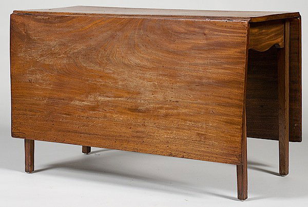 Chippendale Drop Leaf Table : Chippendale Drop Leaf Table American, probably New England, late 18th century. A Chippendale drop leaf table in mahogany, the rectangular top flanked by barrel-jointed one board leaves, over a plain