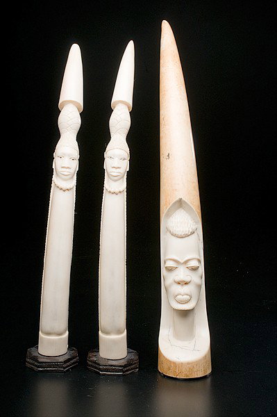 Figural African Ivory Tusks : Figural African Ivory Tusks African, includes a pair of carved ivory female figures and carved ivory male figure in low relief; tallest lg. 22 in.