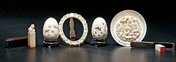 Ivory Desk Items : Ivory Desk Items Asian, an assembled group of six ivory desk items including two stamps in cases with ink, a carved ivory picture frame, a carved ivory disk with dragons, and two decorative bone egg