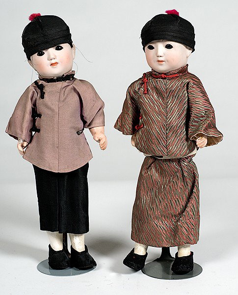 Pair of Chinese Dolls : Pair of Chinese Dolls Chinese, a pair of bisque-headed boy and girl dolls with composite arms and sleep eyes, with illegible marks on back of necks; ht. 12.5 in.