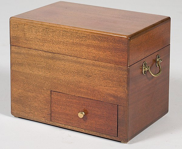 Continental Walnut Tantalus : Continental Walnut Tantalus A Tantalus with a deep hinged top opening to a fitted interior containing two glass bottles with stoppers, four tumblers, and four shot glasses; ht. 11, wd. 13.5, dp. 9.2