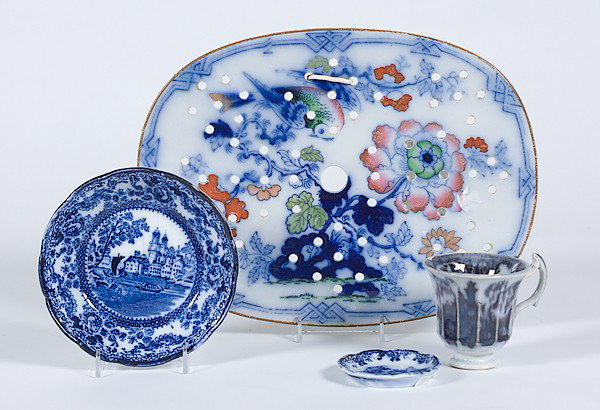 Flow Blue Tablewares : Flow Blue Tablewares English, an assembled group of flow blue tablewares including a polychrome decorated reticulated strainer tray, berry bowl, teacup, and butter pat, pat marked Togo / F. Winale W