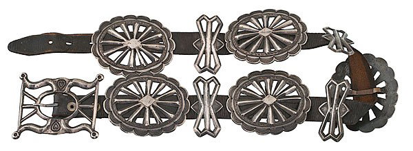 Navajo Tufa-Cast Concha Belt : Navajo Tufa-Cast Concha Belt with five large "wagon wheel" conchas, four matching butterflies, and a buckle with hearts, concha length 3.5 in. x belt length 30 in. ca 1950s