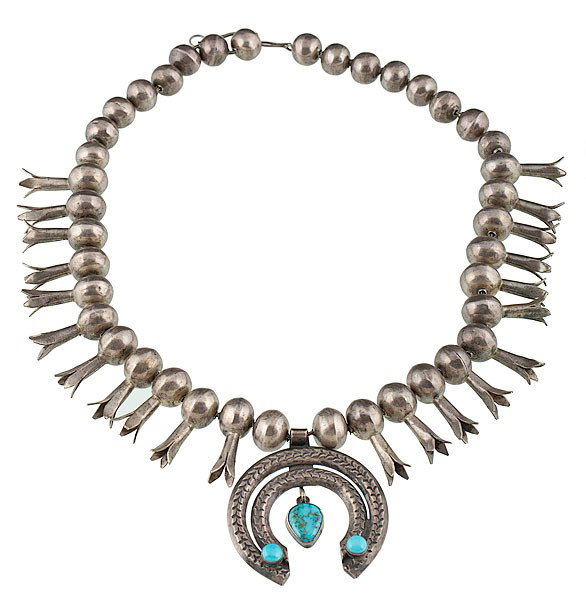 Navajo Squash Blossom with Age : Navajo Squash Blossom with Age With beautifully filed beads strung on silver fox tail; naja with turquoise, length 23.5 in. second quarter 20th century.