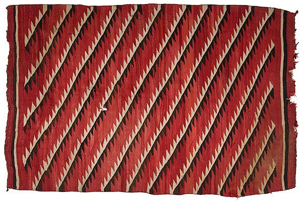 Navajo Transitional Weaving : Navajo Transitional Weaving hand-spun wool woven with a red ground and black and cream serrated bands, 85 in. x 57.5 in. ca 1900