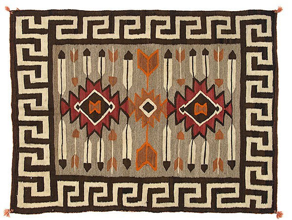 Navajo Double Saddle Blanket : Navajo Double Saddle Blanket hand-spun wool using colors of orange, red, brown, cream, and gray; meandering border frames serrated diamonds, feathers and arrows, 47 in. x 36.5 in. first quarter 20th