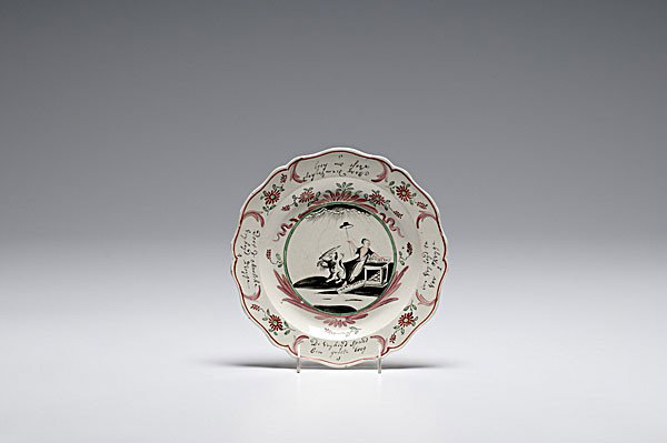 English Polychrome Creamware Plate : English Polychrome Creamware Plate English, 18th century, a Dutch-decorated polychrome creamware plate with scalloped rim and allegorical scene of seated figure with an open book and book at her fee
