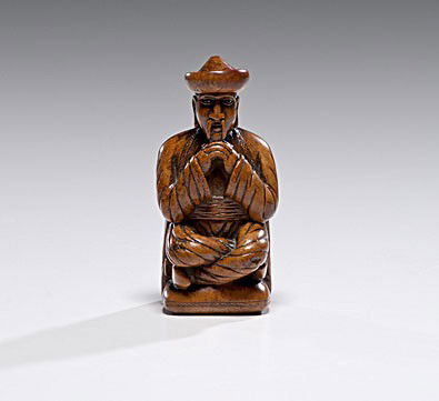 Carved Boxwood Master Snuff Box : Carved Boxwood Master Snuff Box English, 19th century, a carved master snuff box in the shape of a stylized seated Chinese man, with a hinged back opening to a tortoiseshell lined interior, unmarked