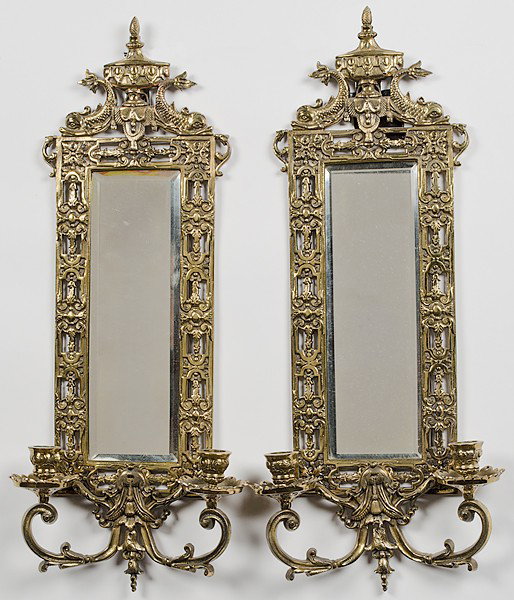Bradley and Hubbard Mirrored Sconces : Bradley and Hubbard Mirrored Sconces American, a pair of gilt metal sconces with beveled mirrors and two handle lights, attributed to Bradley and Hubbard; ht. 23, wd. 10 in.