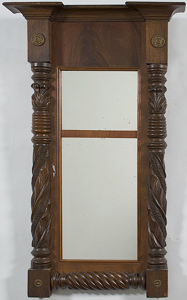 Late Classical Baluster Mirror : Late Classical Baluster Mirror American, a late classical baluster mirror in mahogany having a blocked cornice, a frieze with applied brass rosettes, leaf carved stiles, and a divided mirror plate; 