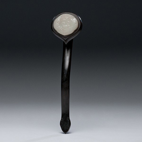Chinese White Jade Ruyi Scepter : Chinese White Jade Ruyi Scepter Chinese, 19th century. A wooden ruyi scepter with a white jade inset plaque with two cranes under a tree carved in relief. Unmarked; lg. 14.25 in. (36.2 cm).