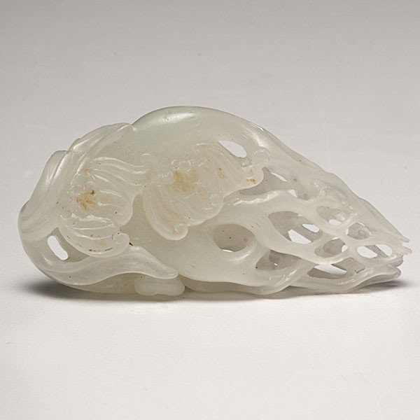 Fine Chinese White Jade Rooted Plant Carving : Fine Chinese White Jade Rooted Plant Carving Chinese, 19th century. A small white jade carving, depicting a rooted plant tapering and layered at the roots, with bats carved in relief; ht. 2 in. (5 c