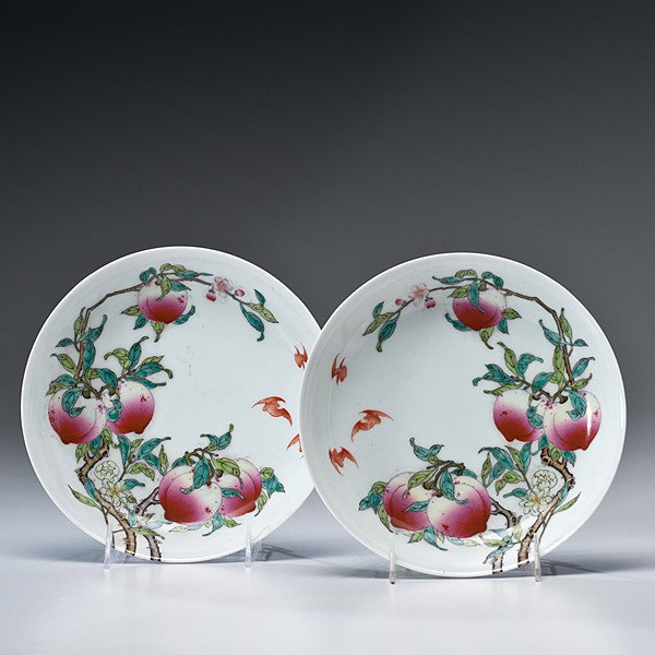 Chinese Famille Rose Dishes : Chinese Famille Rose Dishes Chinese, a pair of famille rose porcelain dishes, the interior having peaches on a flowering branch with three bats spilling over onto the exterior, with an underglazed b