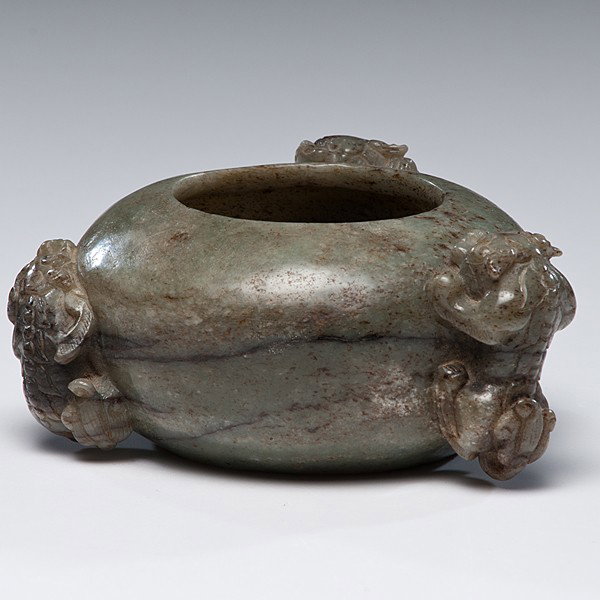 Chinese Archaic Style Jade Water Coupe : Chinese Archaic Style Jade Water Coupe In varied shades, foo dog handles and archaic geometric incised patterns along rim; diameter 4.5 in. (11.43 cm). Provenance: Private Collection, St. Louis, M