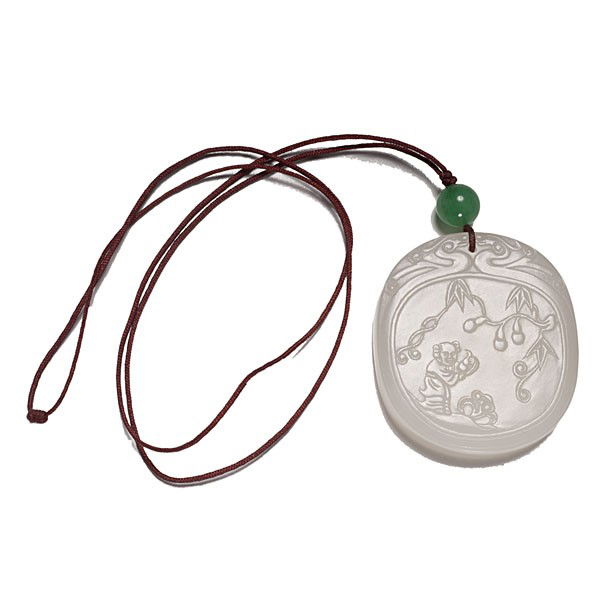 White Jade Plaque : White Jade Plaque Chinese, an oval shaped white jade plaque, carved on one side in low relief with four Chinese characters, the reverse with a standing man holding fruit under a flowering tree, all