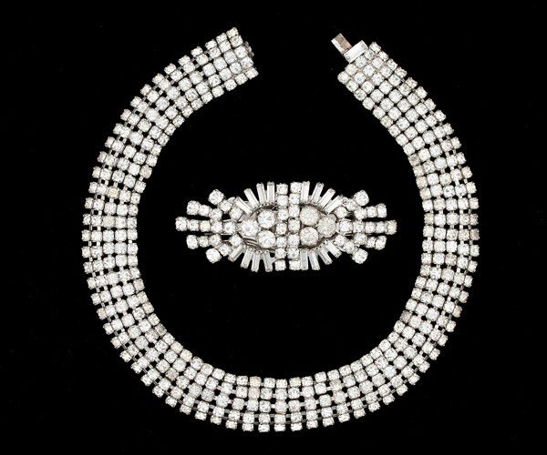 Kramer Duo of Costume Jewelry. : A duo of Kramer to include a necklace and a Brooch/Fur Clip. A Kramer rhinestone choker with five strands of rhinestones and a similarly stunning brooch that can be created into a fur clip with mixed