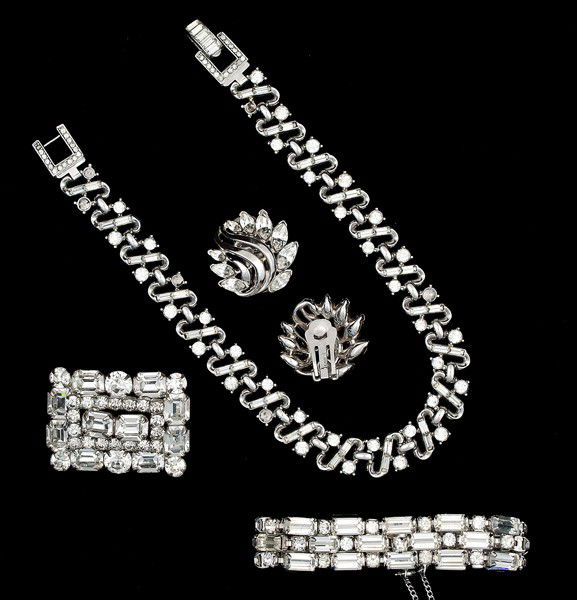 Trifari, Eisenberg & Weiss Costume Jewelry Collecti: A pair of Trifari ear clips, an Eisenberg bracelet, a Weiss brooch and a Trifari choker style necklace; all signed pieces are stamped.