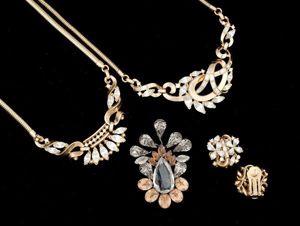 Schreiner & Trifari Costume Jewelry Collection : A Schreiner brooch, a pair of Trifari ear clips and two Trifari necklaces; all signed pieces are stamped and sold in 'AS IS' condition.
