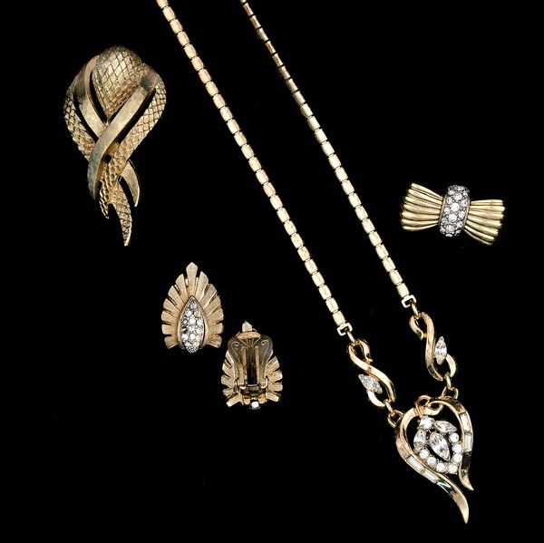 Marboux, Monet, Carolee, Trifari & Unsigned Costume: A pair of Marboux ear clips, a Monet brooch, a Carolee "bow" brooch, a Trifari necklace with an abstract center pendant; all signed pieces are stamped.