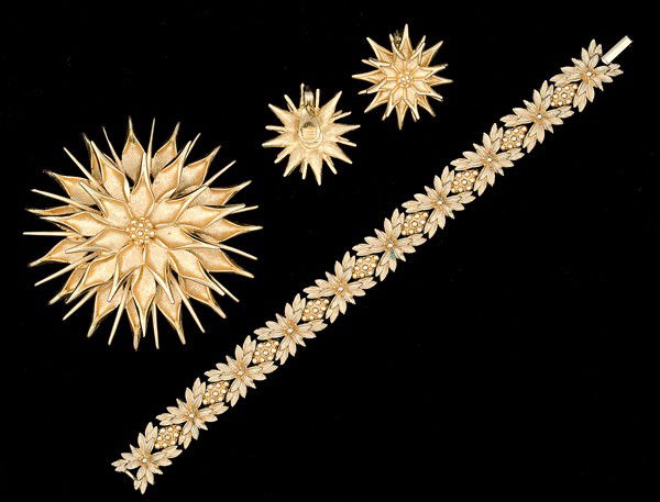 Sarah Coventry & Monet Costume Jewelry Collection : A Sarah Coventry bracelet, a Monet brooch with a pair of matching Monet ear clips; all signed pieces are stamped .